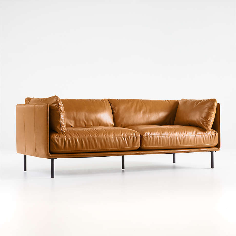 Slim Leather Sofa With Puffy Cushions and Sleek Iron Legs 1
