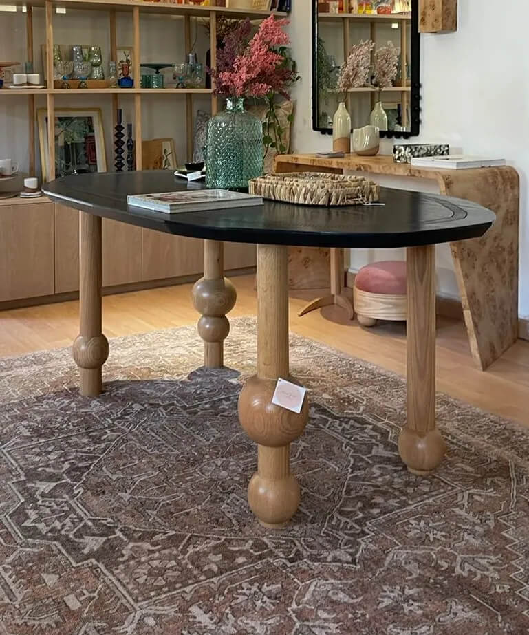 Bombona Black Oval Dining Table With Sculpted Wooden Legs 3